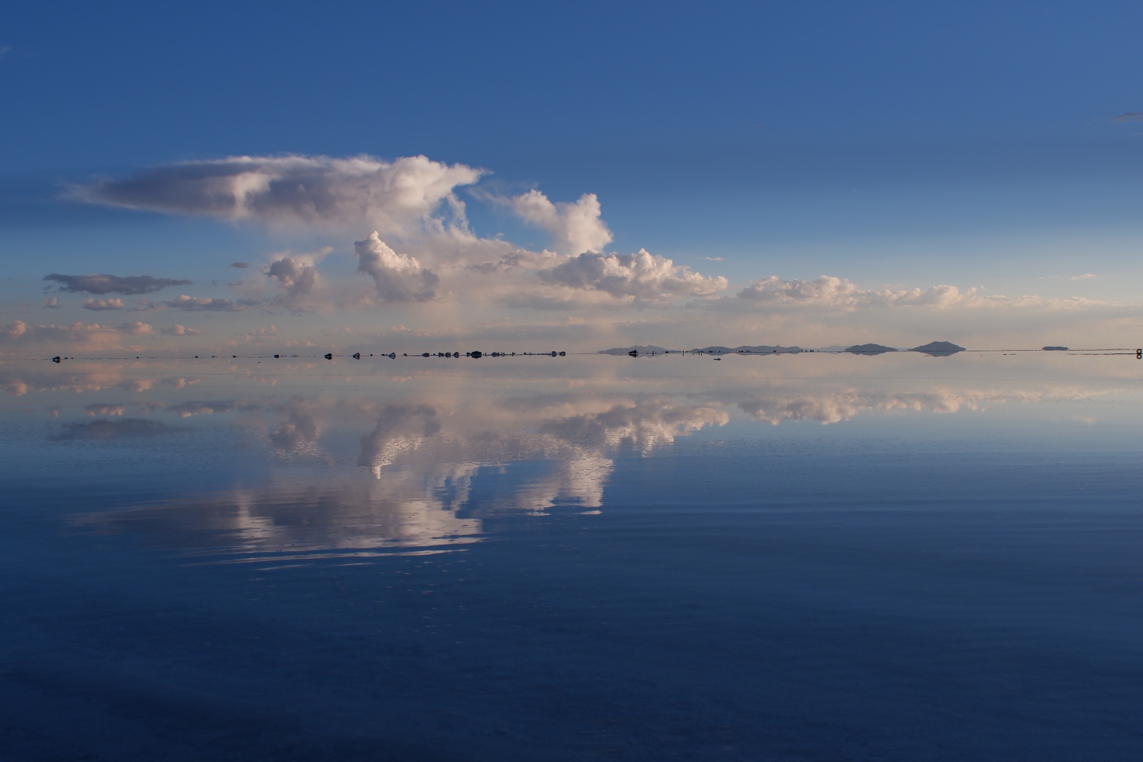 Learning to Stay — vast reflective salt flats under an open sky